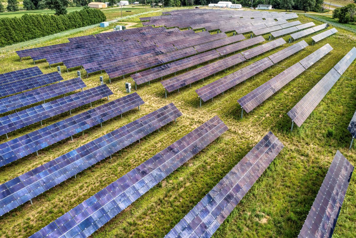 Solar energy infrastructure in an agricultural landscape, illustrative sector photography